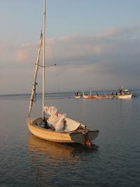 A small well-equipped sailboat, fairly tall rigging with a centerboard. Bought in Manila from Stephen Groff. The boat originally came from <br>Canada and was brought to Bataan area, Philippines, then to my place in Anilao, Batangas. It was then shipped to Nesodden, Norway and finally<br>sold and moored at Hovedø, Oslo. I capsized a couple of times both in Balayan Bay and outside Blylaget in Bundefjorden. Sailing solo it<br>was difficult to get it upright and drained (it had a automatic draining system, but this required some speed which was difficult to reach with<br>the boat full of water).