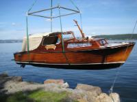 A 1965 Swedish-built mahogany cruiser bought from Leif Holme in 2007 who had restored the boat to mint condition. The original Volvo Penta<br>marinised gasoline engine was eventually replaced with a 140HP Mercruiser engine. The boat was used for yearly summer vacations in Oslofjord<br>and the Swedish West Coast.